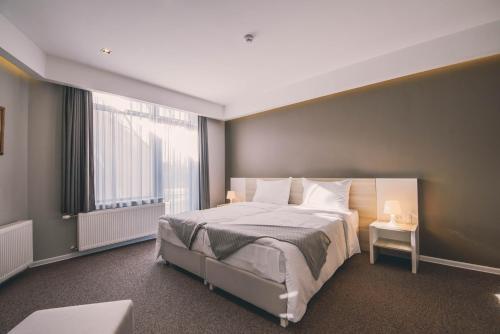 Posteľ alebo postele v izbe v ubytovaní Hotel Nova Bentbaša