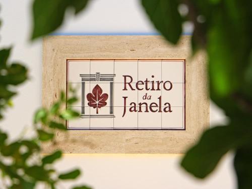 a sign for a restaurant with a maple leaf on it at Retiro da Janela in Boliqueime