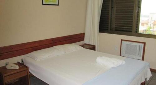 Ένα ή περισσότερα κρεβάτια σε δωμάτιο στο Apto Ponta das Canas - Floripa