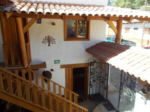 a house with a staircase and a roof at Hoteles Viva Tapalpa in Tapalpa
