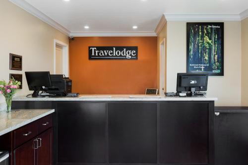 an office with a counter with two computers on it at Travelodge by Wyndham Eureka in Eureka