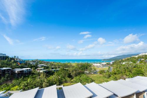 a view of a city and the ocean at Azure Sea Whitsunday Resort in Airlie Beach