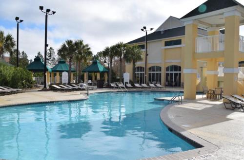 a swimming pool at a resort with lounge chairs at Unit at the Sheraton Broadway Plantation in Myrtle Beach