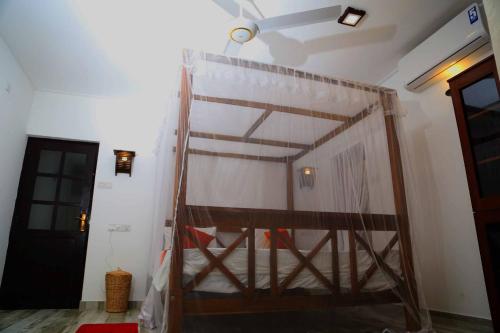 a bunk bed in a room with a ladder at Villa Kandy in Kandy