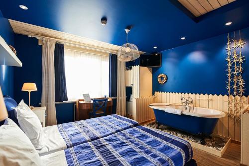 Postel nebo postele na pokoji v ubytování Full House Hotel