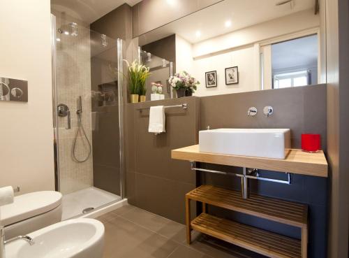 a bathroom with a sink and a shower at Luxury Flat Riberi sotto la Mole in Turin