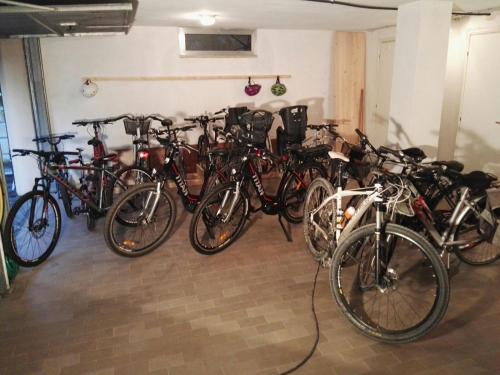 a bunch of bikes parked in a garage at GiaLoSa Biker House in Villa Verucchio