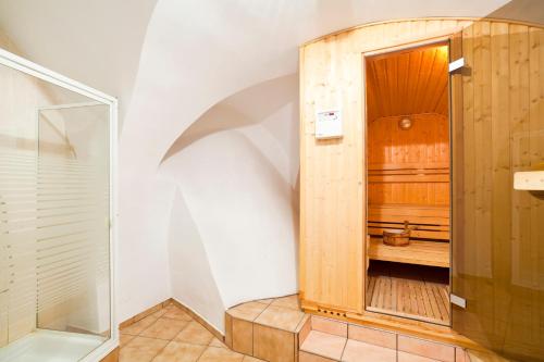 a bathroom with a shower and a wooden cabinet at Zamek Czocha in Leśna