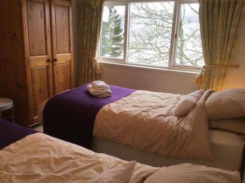 Un pat sau paturi într-o cameră la The Sheiling