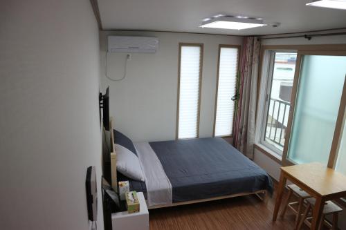 Postel nebo postele na pokoji v ubytování Blue Island Guesthouse