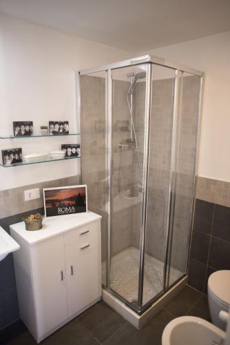 a shower with a glass enclosure in a bathroom at Suite GG in Vatican in Rome