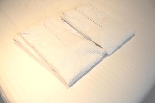 a white sweater is sitting on a table at Hotel Art Stay Naha Kokusai-Dori in Naha