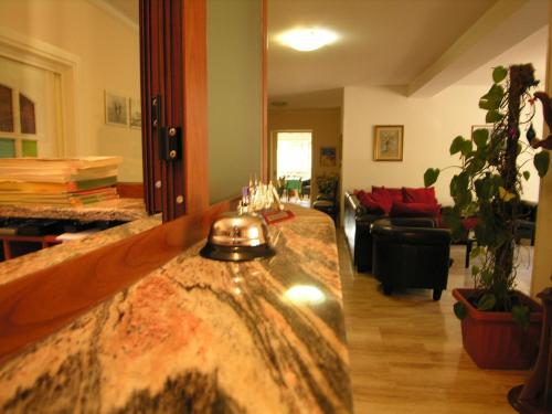 a living room with a table with glasses on it at Hotel Villa Aurora in Latina