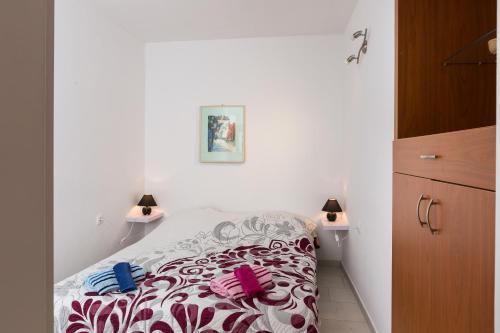 Кровать или кровати в номере Apartments Luna