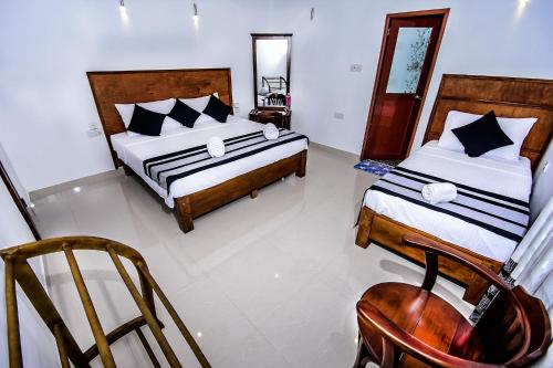 Ένα ή περισσότερα κρεβάτια σε δωμάτιο στο Heavens Door Guest Inn