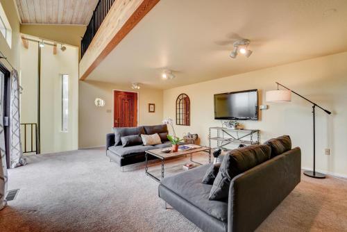 a living room with two couches and a flat screen tv at Napa Valley Guest House Cottage in Napa