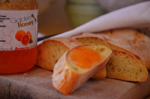 a close up of a piece of bread with an orange peel at Villa Hirschen in Zafferana Etnea