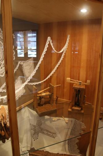 a glass display case with a machine in a room at Penzion Klopacka in Špania Dolina