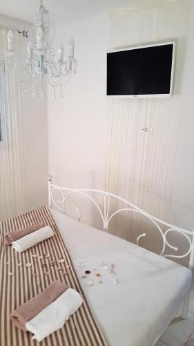 Postel nebo postele na pokoji v ubytování Apartmani Šarm