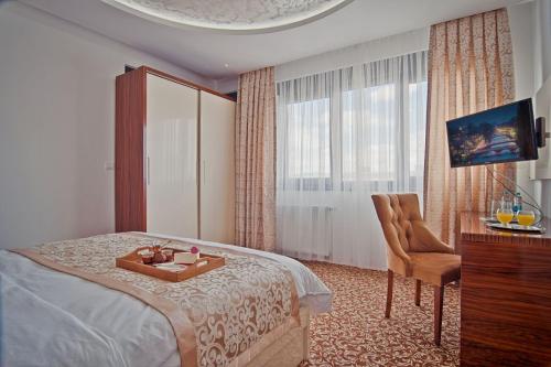 Postel nebo postele na pokoji v ubytování New Hotel