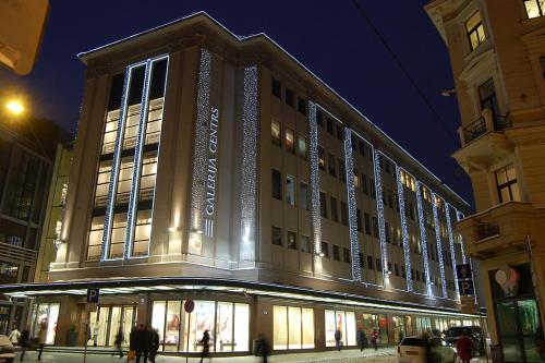 a large building on a city street at night at Luxury Home In Heart Of Oldtown, Quiet in Rīga