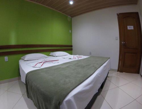 Cama o camas de una habitación en Pousada Belafonte Riocentro