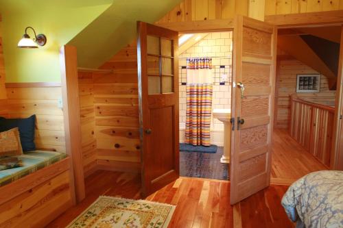 a bedroom with an open door to a bathroom at Juniper Lane Guest House in Friday Harbor