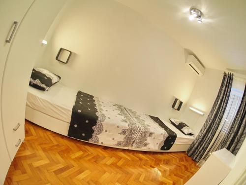 Postel nebo postele na pokoji v ubytování Apartment Sandra