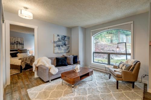 a living room with a couch and a table at Marquise by Whistler Blackcomb Vacation Rentals in Whistler