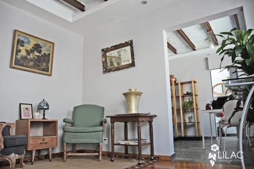 a room with chairs and a table and a mirror at Centenario 29 in Mexico City