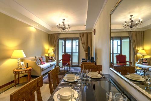 Χώρος καθιστικού στο Orchard Parksuites by Far East Hospitality
