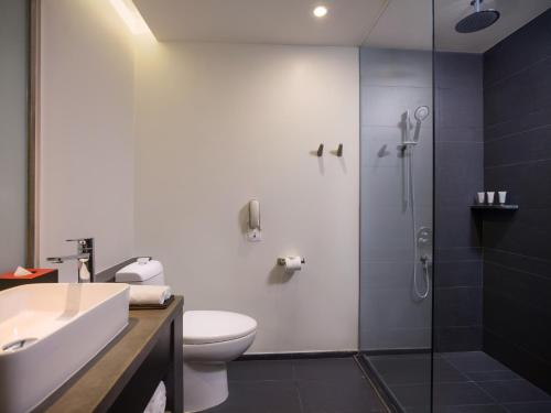 a bathroom with a shower and a toilet and a sink at Pao's Sapa Leisure Hotel in Sa Pa