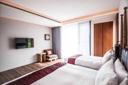 Cama o camas de una habitación en Dreamer Boutique Hotel