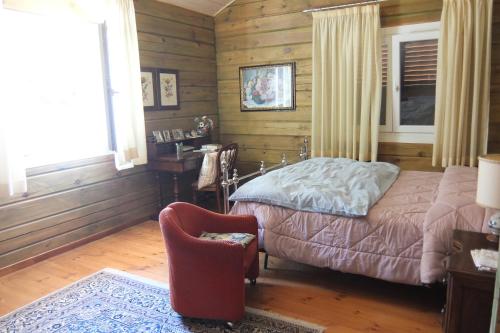 Un pat sau paturi într-o cameră la Chalet Paola