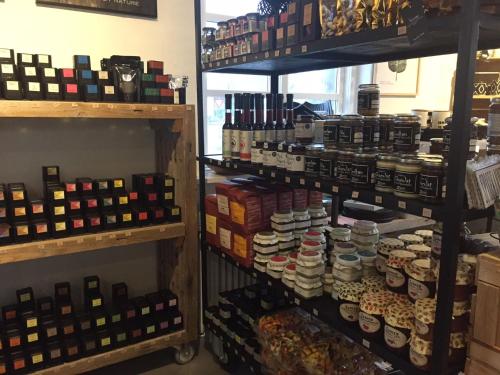 a store filled with lots of bottles of wine at Refborg Hotel in Billund