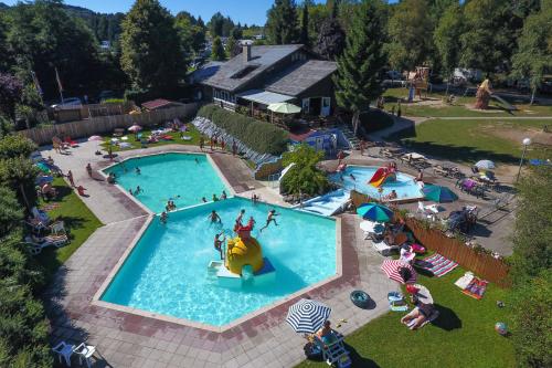 an overhead view of a pool at a resort at ArdenParks Petite Suisse in Dochamps