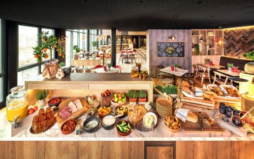 a bakery with many different types of food on display at Radisson Hotel Zurich Airport in Rümlang
