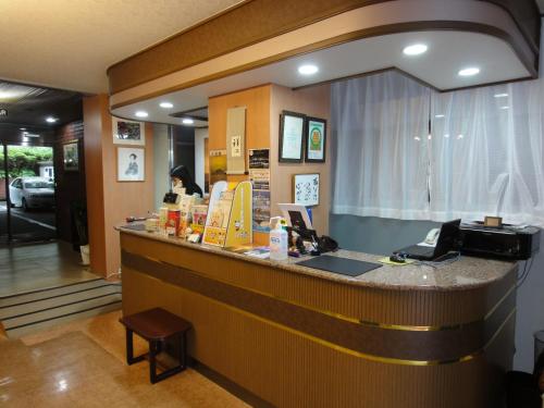 a lobby of a restaurant with a reception counter at Royal Hotel in Nagasaki