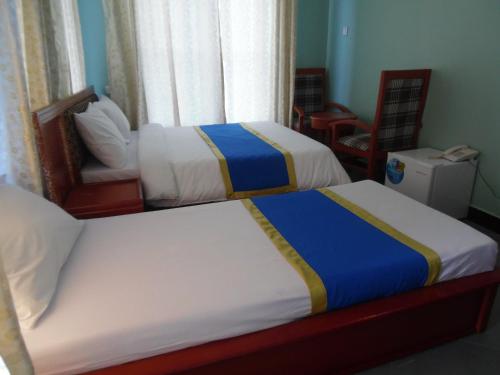 Postel nebo postele na pokoji v ubytování BL Airport Hotel