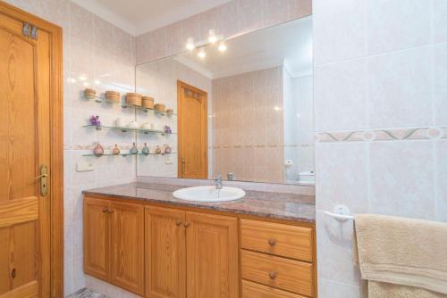 a bathroom with a sink and a mirror at Ca'n Canastro in Binissalem