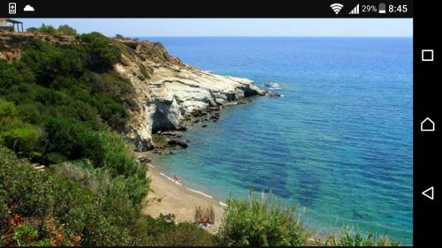 a view of a beach and the ocean at Εmmi in Koutsounari