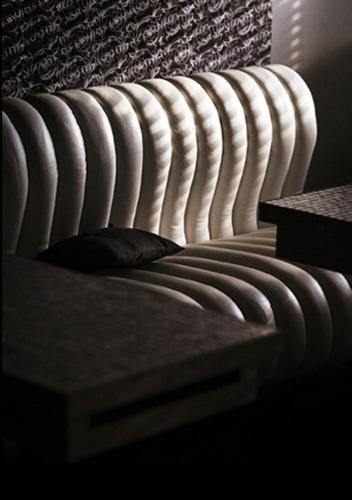 a bed with a pillow on it in a room at Hotel Esprit in Bratislava