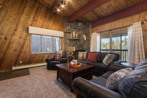 a living room with a couch and a table at Phoenix 118 in Steamboat Springs