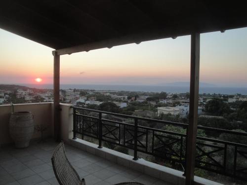 a balcony with a view of the sunset at Stan&Family in Kalavárda