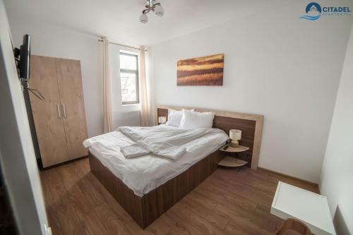 מיטה או מיטות בחדר ב-Citadel Aparthotel