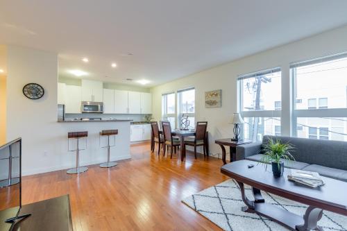 a living room with a couch and a table at Sage Apartments Boston Logan Airport Chelsea in Chelsea