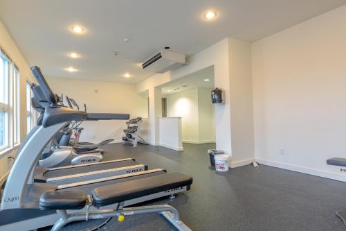 a gym with a row of cardio machines at Sage Apartments Boston Logan Airport Chelsea in Chelsea