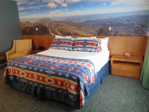a bedroom with a bed with a view of the mountains at Bryce Canyon Resort in Bryce Canyon