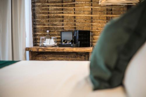 a bedroom with a bed and a television on a table at 262 Boutique Hotel in Lisbon