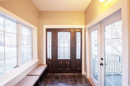 a hallway with a door and windows in a house at Home in Heart of Salt Lake City Home in Salt Lake City